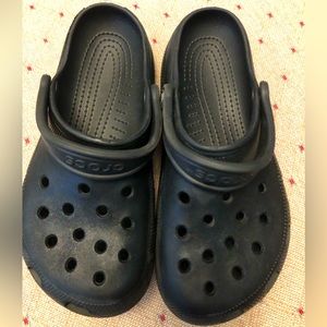 Black crocs.  Childrens size 4, ladies 6 in guc.